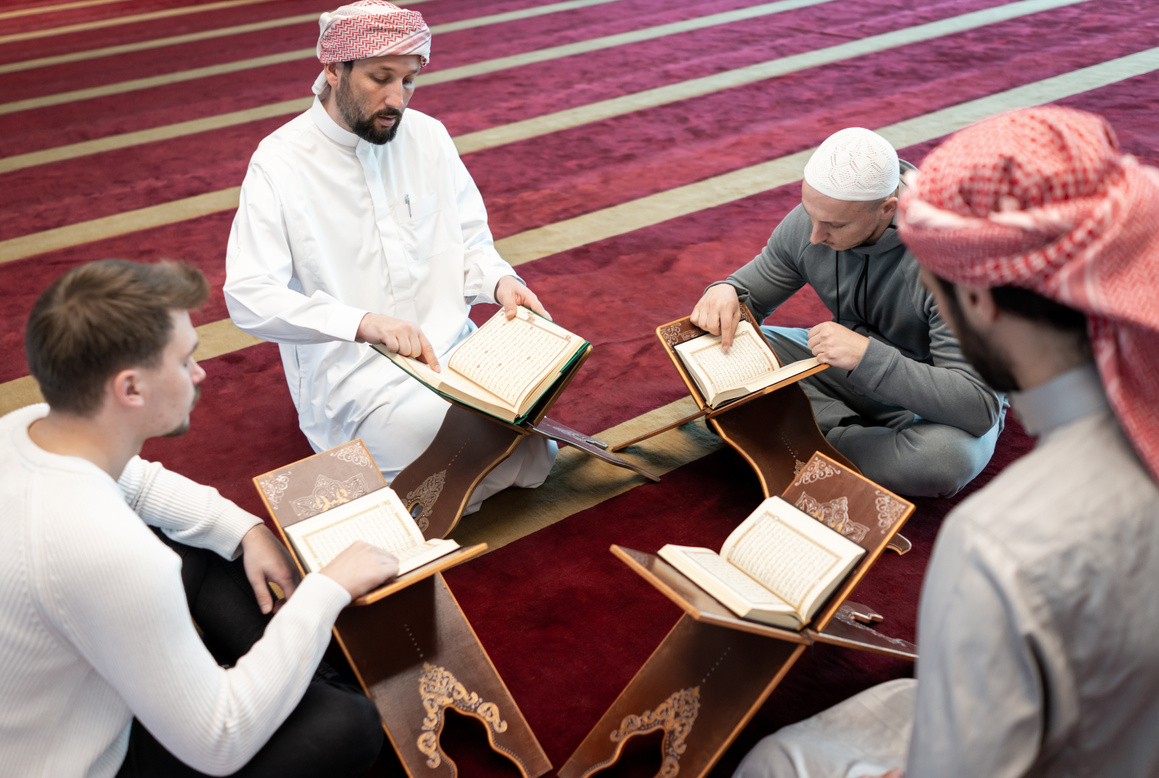 Group of Men Studying the Quran  